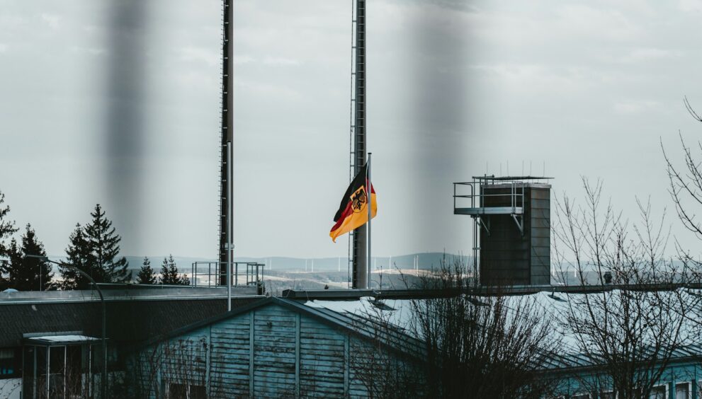 black and yellow flag on top of building