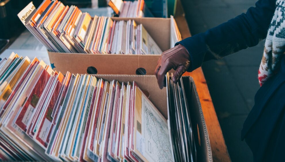 person touching book box